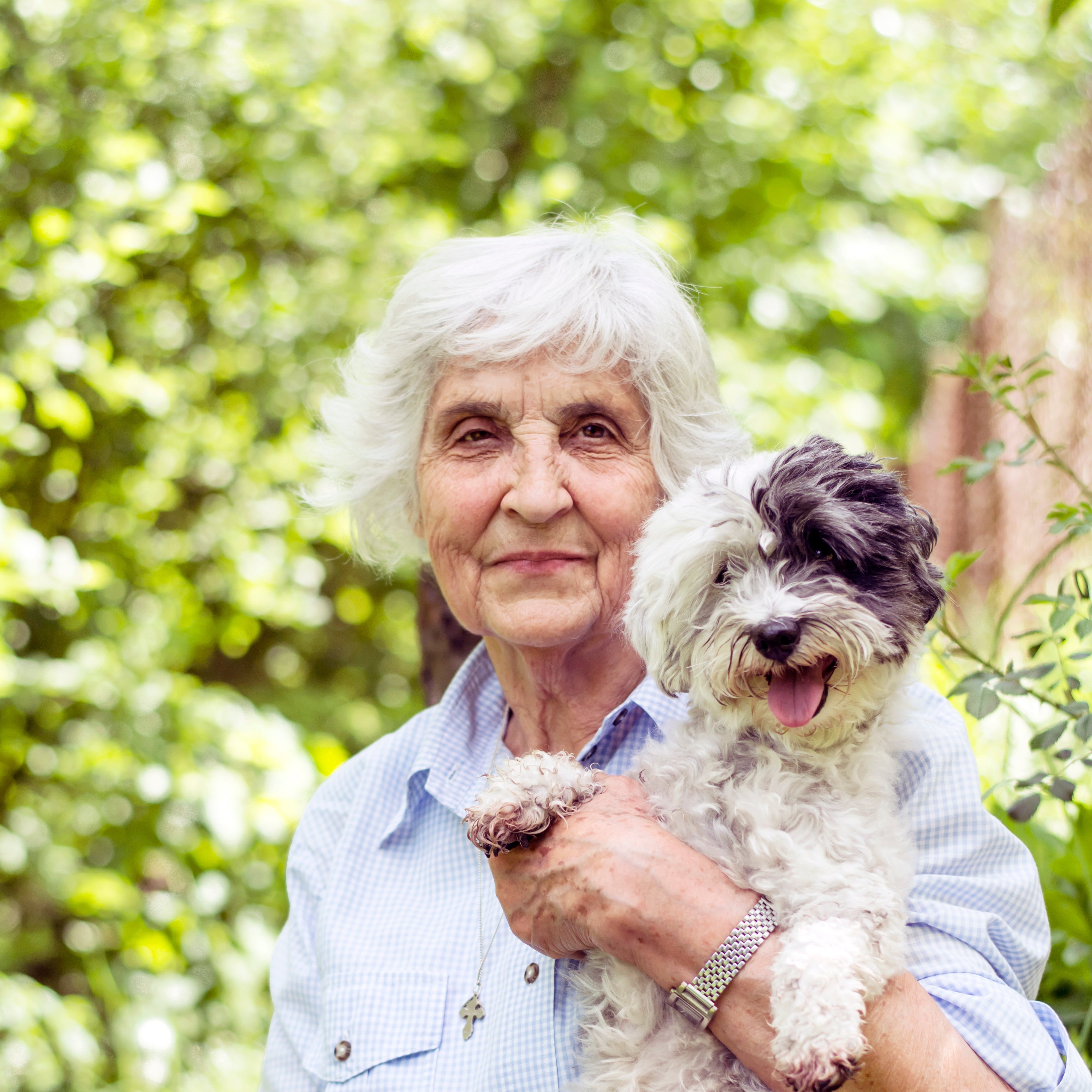 files/retired-woman-sitting-with-her-dog.jpg